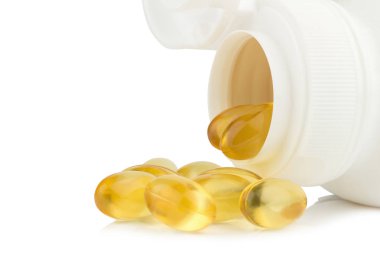 Kapsül balık yağı ile seçici odak izole üzerinde beyaz backgrou