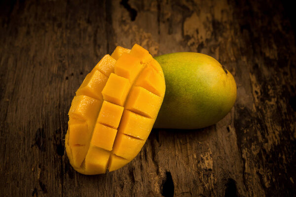 mango on a dark wood background