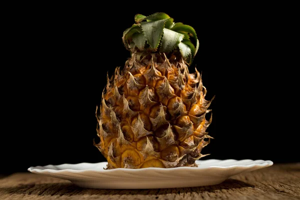 Pineapple on old wooden. black background — Stock Photo, Image