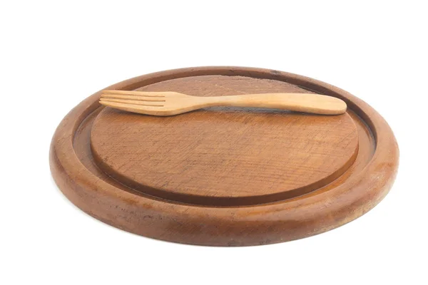 Planche à découper en bois. forme circulaire. et fourchette isolée au fouet — Photo