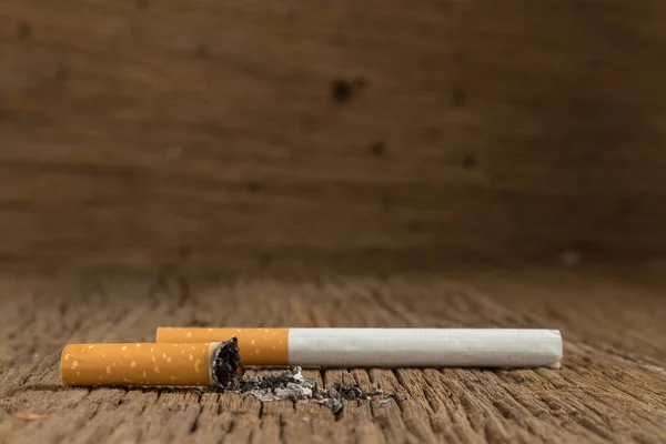 Tobacco cigarette. stub.  on wooden Stock Picture