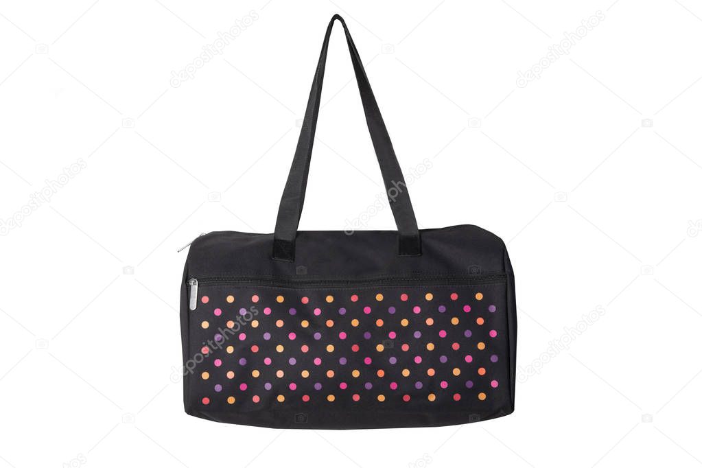 Bags fashion. Closeup of multicolored dotted overnight bag on a white background. Travel concept.