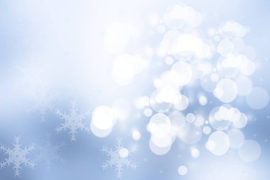 Soyut bulanık kış şenliği ya da parlak mavi ve beyaz bokeh ışıklı kar manzaralı mutlu yeni yıl arkaplanı. Tasarımın için yer aç. Kart kavramı.