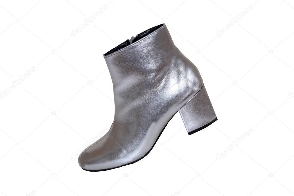 Womens boots and shoes. A pair female silver boots isolated on a white background. Leather shoe fashion new collection 2019.