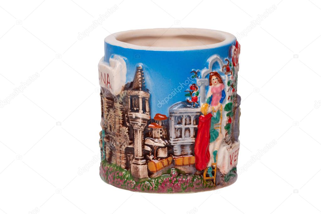 Romeo and Juliet concept. A souvenir made from ceramic of the balcony with Romeo and juliet isolated on a white background. Famous figures from Verona in Italy.