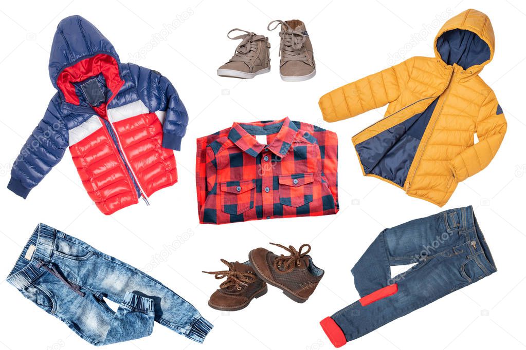 Collage set of children clothes. Denim jeans or pants, shoes, a shirt and rain jackets for child boy isolated on a white background. Concept spring autumn and summer clothes. Close-up.