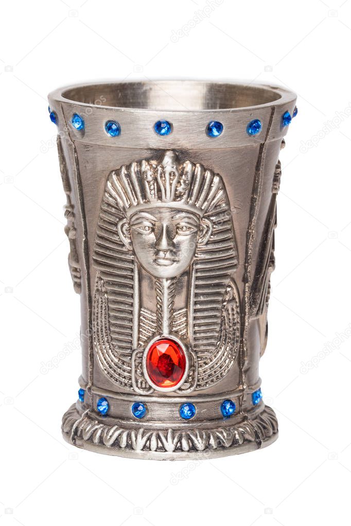  on a white background. Egypt souvenir. Macro.Egyptian art. Close-up of egyptian metalic cup with gems isolate