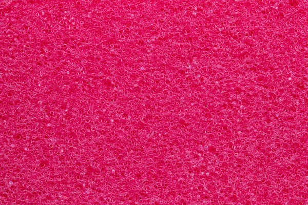 Sponge texture background. Close-up of red bath sponge texture w — Stock Photo, Image