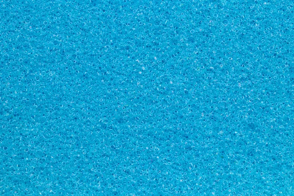 Fond de texture éponge. Gros plan sur la texture de l'éponge de bain bleue — Photo