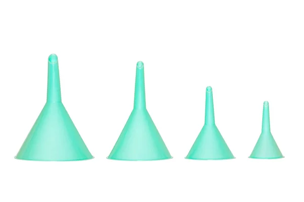 Funnel isolated. Closeup of four turquoise plastic funnels of di