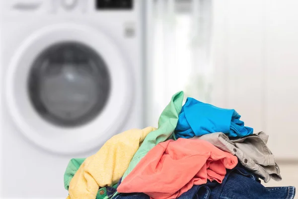 Pile of clothes. Stack of colorful dirty clothes ready for the l — Stock Photo, Image