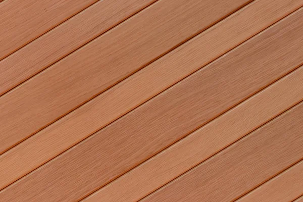Fundo de textura de madeira. Closeup de um detalhe de uma bela porta de entrada marrom-clara de madeira. Macro . — Fotografia de Stock