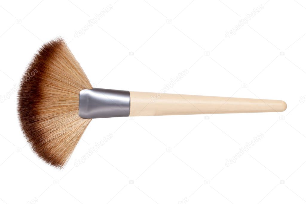 Closeup of a wooden new professional makeup brush isolated on a white background. Concept beauty. Macro photograph.