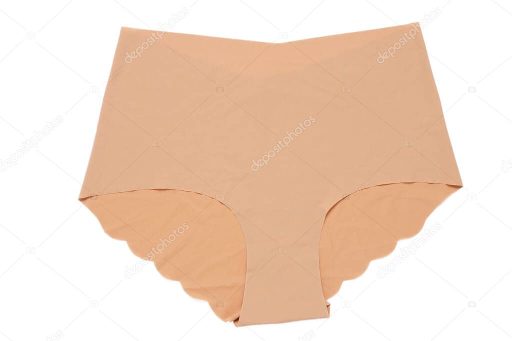 Underwear woman isolated. Close-up of beige or flesh-colored seamless panties isolated on a white background. Useful for wearing under bright or transparent dresses. Underwear fashion.