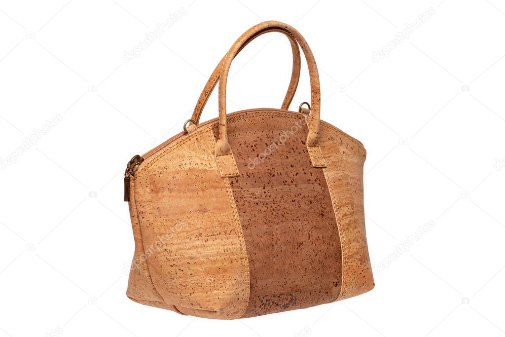 Cork fashion. Fashionable brown female luxury women handbag or shoulder bag made from oak cork isolated on a white background. Womans accessories.