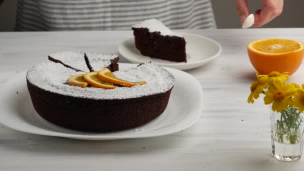 Woman eating delicious slice of chocolate cake — Stock Video