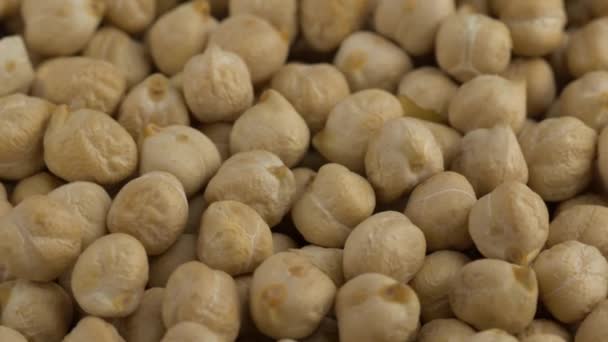 Rotating raw chickpea beans, vegan healthy nutrition. — Stock Video