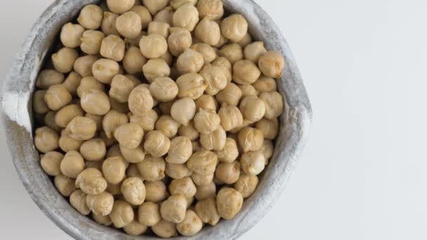 Rotating raw chickpea beans on a white background. — Stock Video