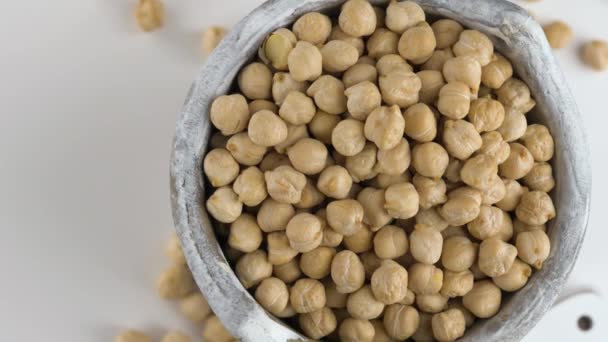 Rotating raw chickpea beans, vegan healthy nutrition. — Stock Video