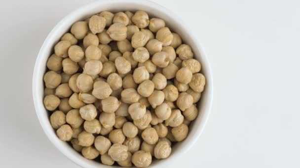 Rotating raw chickpea beans on a white background. — Stock Video