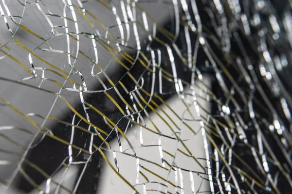 Broken glass. Web of cracks. Abstract background