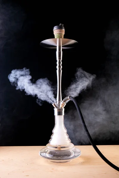 smoking hookah with cloud filled with hot coals...