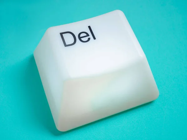 Big Delete Computer Key Button Light Box Isolated on Aqua Blue or Green Background. Eraser Concept.