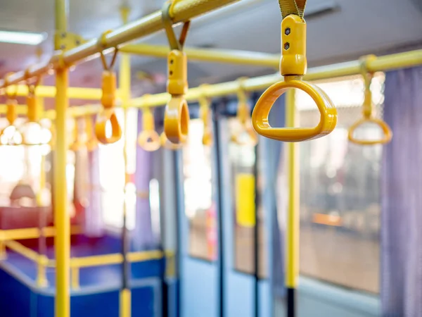 Yellow Handrail Holding Bar for standing passengers in the shuttle bus in the airport.