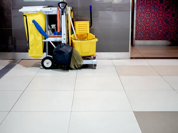 Cleaning tools cart wait for cleaning. Bucket and set of cleaning equipment in airport with copy space. Cleaning service concept.