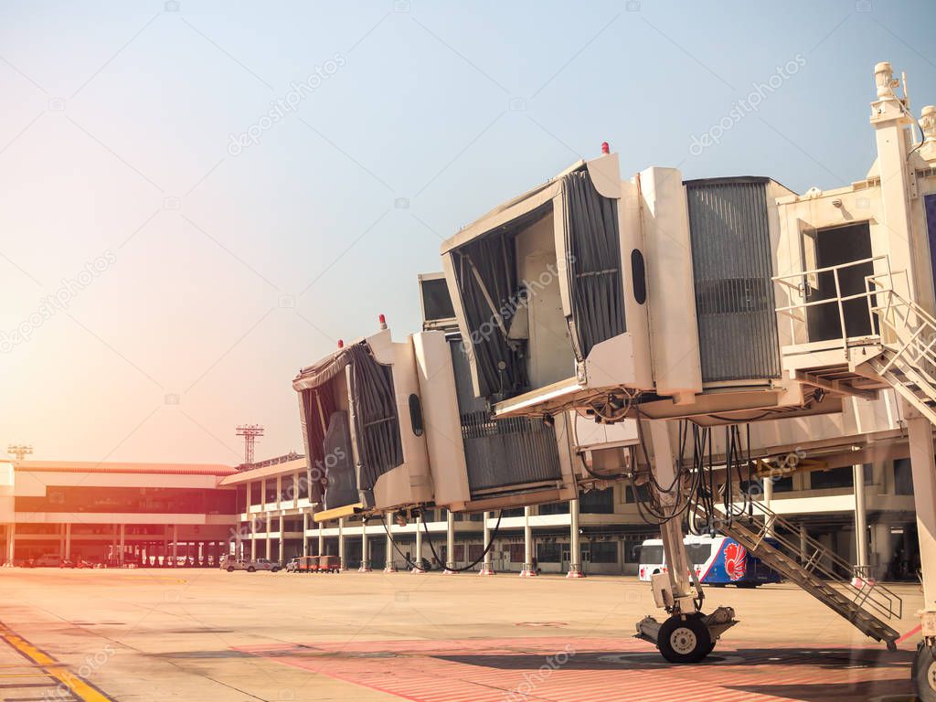 BANGKOK, THAILAND-November 5, 2018: Aero bridge or jetway in airport. Airplane bridge in Don Muang airport support for passengers boarding to plane on sunset.