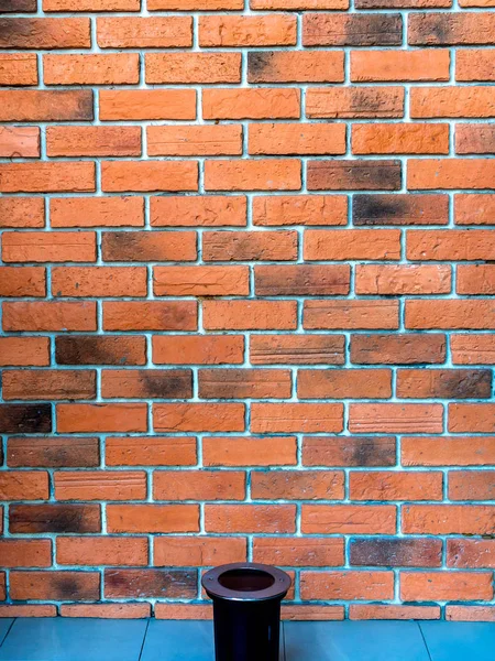 Red brick wall background with LED spotlight ground on the ground vertical style.