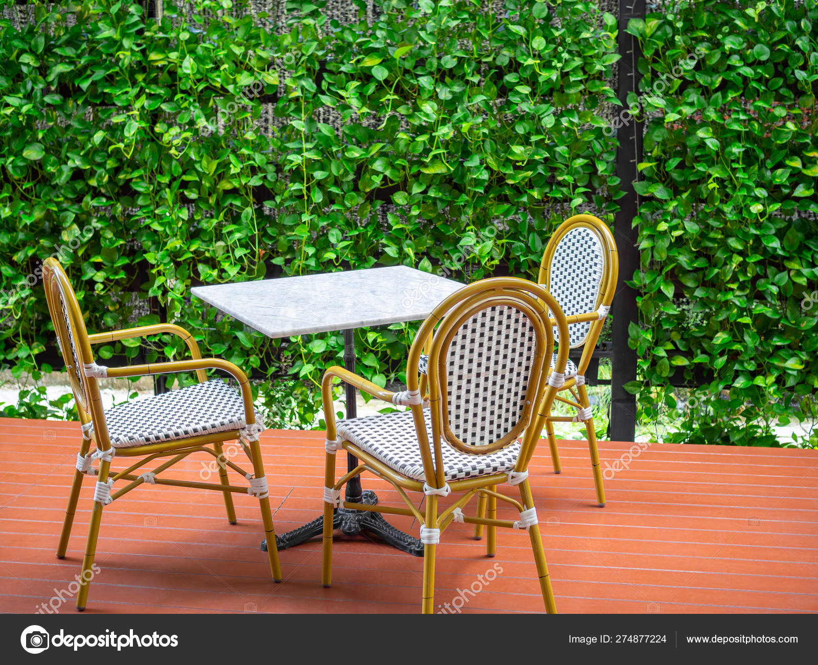 Three Wooden White Vintage Chairs With White Marble Table On Red