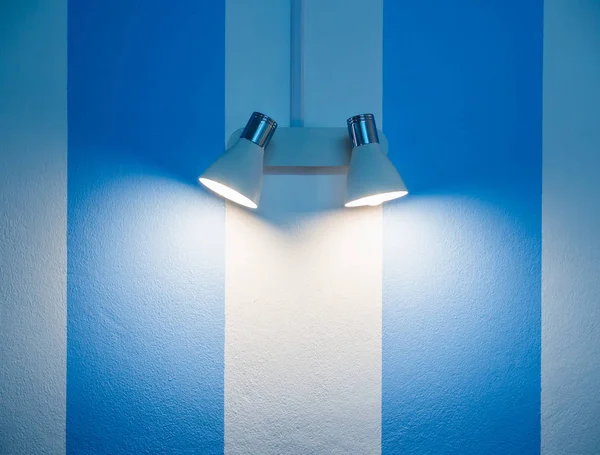 Wall lamp on white and blue wall background — Stock Photo, Image