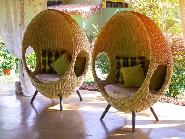 Two rattan egg chairs with pillows. — Stock Photo, Image