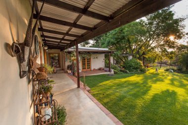 Johannesburg, South Africa, 27 October - 2015: Exterior of converted barn with view of porch. clipart