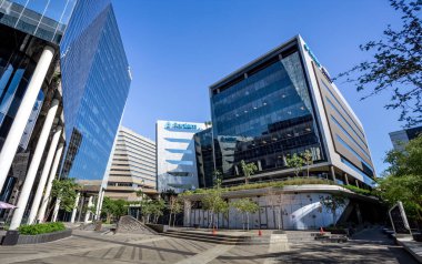 Johannesburg, South Africa, 30 November - 2018: Modern office buildings in city centre with glass facades. clipart