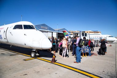 Passengers boarding aircraft clipart