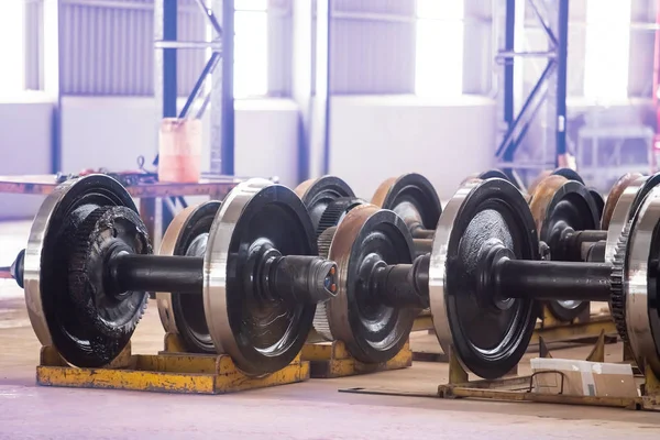 Train wheels in engineering workshop.