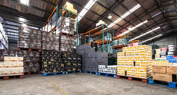 Alcohol apilado en almacén . Imagen De Stock