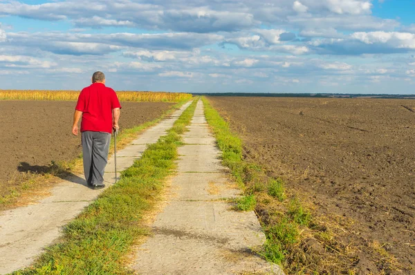 Senior Man Walking Country Concrete Road — Stock Photo, Image