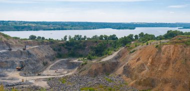 Quarry beside big river Dnepr near Dnepropetrovsk city, Ukraine clipart