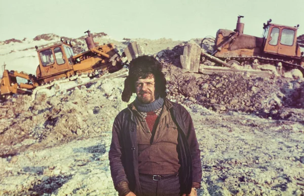 Portrait of young soviet gold-prospector - Vintage photo taken on a gold-field in tundra, Chukchi Peninsula, USSR, July 1984