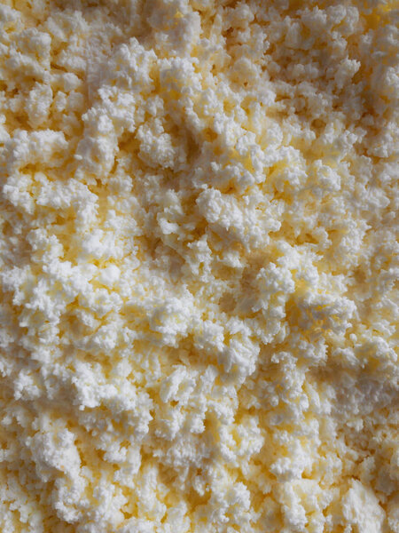 Food background- layer of nonfat cottage cheese closeup 
