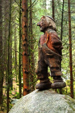 Ardal, Norway - June 15, 2018: Eventyrskogen, the Fairytale Forest near Ardal in Ryfylke. Children theme park in a green mossy forest with sculptures of trolls, referencing to old Norwegian tales. clipart