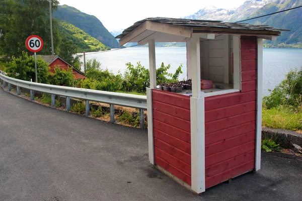 A roadside self-service kiosk selling sweet cherries near Lofthus, Hardangerfjord, Norway