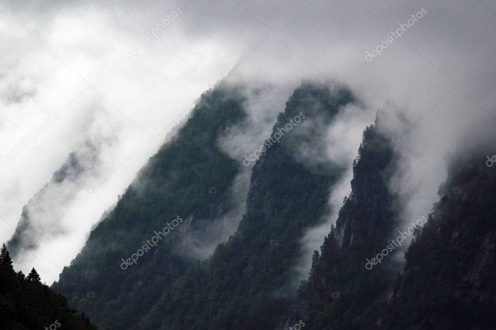 Clouds and fog on a mountain slopes 