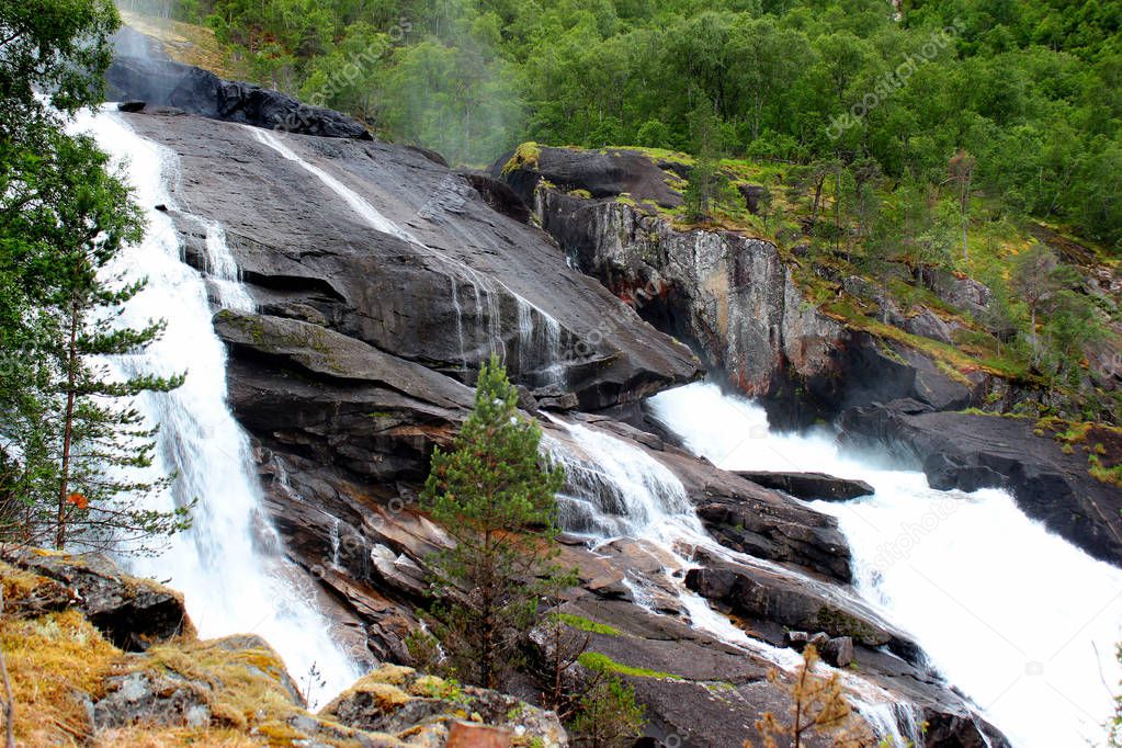 Tveitafossen falls, the lowest in cascade of four waterfalls in Husedalen valley, Kinsarvik, Norway