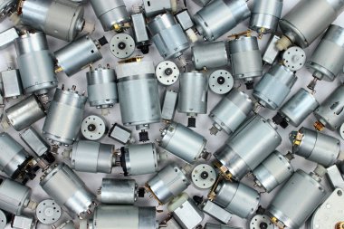 Pile of old electrical dc motors clipart