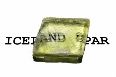 Double refraction of text in iceland spar crystal.  clipart