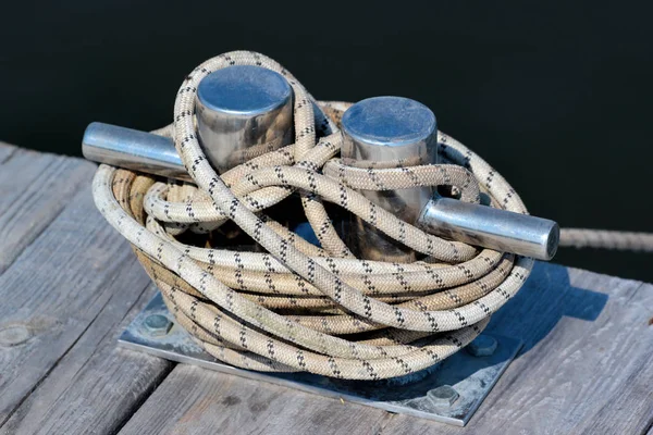 Shiny metal bollard on a pier — Stock Photo, Image